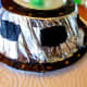 Use black paint and gold glitter glue to decorate the spaceship.