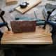 Sanding the cut edge straight and smooth with an electric sander.