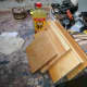Assembling the rack: Wood ready for assembly including the two side panels, original top and bottom piece.