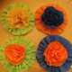 These rosettes are embellished with crepe paper carnations.