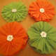 These rosettes are embellished with buttons.