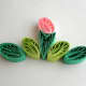 A quilled design with comb quilled coils.