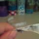 Pinch the center of the ribbon together