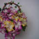 This is a basket of flowers made of foam.