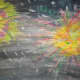 Fireworks colored with oil pastel then painted in watercolor. The watercolor resists the oil.