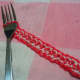 The instructions call for using a fork as a loom! Give the bands a tug as you work to keep them tight.