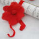 Music scroll and a red wet felted rose.