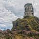 Perched on the summit of a rocky gritstone outcrop The tower or Mow Cop castle is a striking landmark that can be seen from miles around.