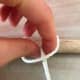 Pull the rope through the loop.