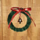 Attach a tiny bell in the middle of the small wreath. 
