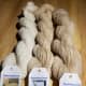 Subtle variances between white and beige alpaca yarn.