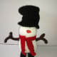 Photo 9. Snowman with his shoes and arms in place.