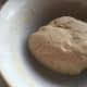 Draw the mixture together with your hands and kneed until smooth. You may think at first that the mixture is too dry, but do not add more liquid. Persevere until you have a smooth dough. Roll out on a floured board.