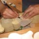 Using templates and tracing paper to draw out the patterns for carving