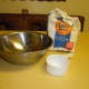 Prepare your flour mixture for the paper mache glue with flour,water and a mixing bowl.