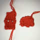 Photo 4. Knitted robin's feet before (left) and after (right) sewing up.