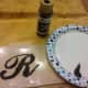 Paint stencil with desired color of fabric paint.