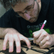 my husband cutting out his design