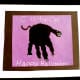 A black handprint makes a cute halloween cat.