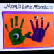 Green and purple painted hands make out of this world monsters and aliens.