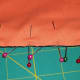 Pin the 2nd piece of fabric to the bottom piece, making sure to include the pom pom lace.