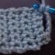 To make buttonhole, chain several stitches where you want the hole to be and skip that number of stitches before continuing your row.