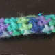 Single crochet or half double crochet around until bracelet is the size you want.  Then fasten off and sew ends together.