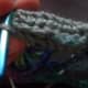Slipstitch or sew band around chains.