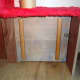 Cat flap insulator upholstered with carpet to keep the draughts out