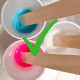 Slowly stirring your paints and pouring medium with a wood craft stick will blend the colors without adding air bubbles.