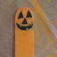 Face painted onto the top of the popsicle stick.