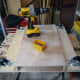 Fitting the plywood to the base of the housing for the plinth drawer