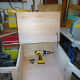 Stay bar fitted to lid, to keep it in place when open