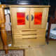 Completed sewing machine cabinet in Conservatory with doors and lid closed