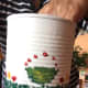 The golden oil paint was added to the green of the painted flower pots. Red dots were added on top of the pots.