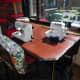 Repurposed table in situ, in our conservatory, with sewing machine and overlocker out and ready for use.