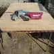 Table top sanded back to bare wood with belt sander.