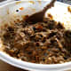 Using a wooden spoon, everybody has to have a stir, for Good Luck!