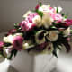 Cascade of calla lily and roses in subtle purple and rose is lush and romantic..