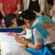 The couple remains quiet, with their heads bowed and hands in prayer.
