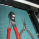 Combination pliers on the left Needle nose pliers on the right
