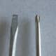 Flat head screw driver on the left, Phillips head screw driver on the right.