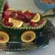 Make a watermelon baby carriage to serve your fruit.