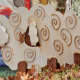 These wooden sheep are displayed around the panel and give it dimension.  A very clever idea!