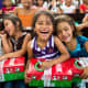 Girl excited to open their shoeboxes in Costa Rica.