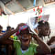 An excited girl celebrating her gifts in Haiti.