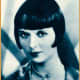 Publicity photo of Louise Brooks from short biographical sketch-book Stars of the Photoplay, 1930 (public domain).