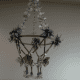 The surprisingly elegant chandelier my daughter and I made of tin foil, newspapers, paper straws, mirrors, yarn, tissue paper, twine, and part of an embroidery hoop.
