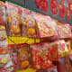 Cheerful Chinese gods of fortune, adorned with the Chinese character for luck, are perpetually popular festive decorations.