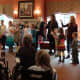 Here, the home-schooled children pay a visit to sing for the seniors.